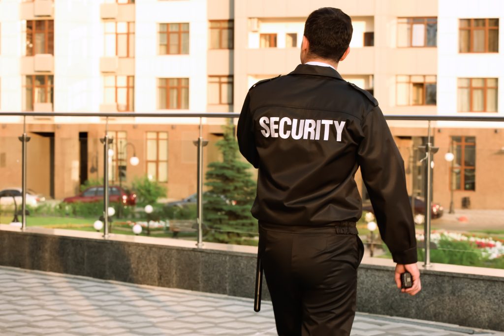 male security guard, outdoors